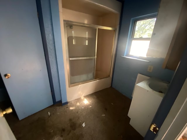 bathroom with walk in shower and vanity