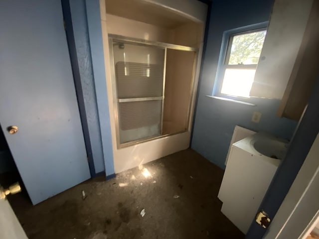bathroom with a shower stall and vanity