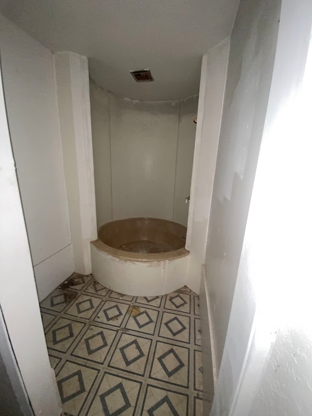 bathroom featuring tile patterned flooring