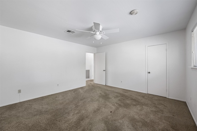 unfurnished bedroom featuring carpet and ceiling fan