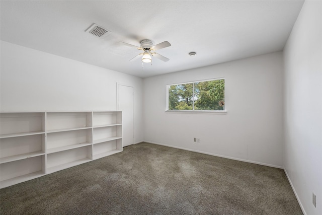 empty room with carpet floors and ceiling fan