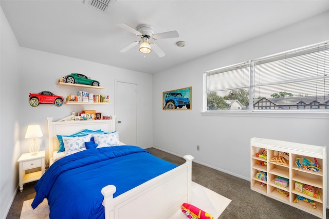 bedroom with dark carpet and ceiling fan