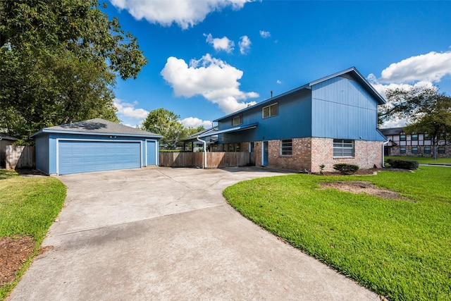 view of side of home with a yard and a garage