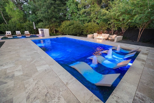 view of swimming pool with a patio and an outdoor hangout area