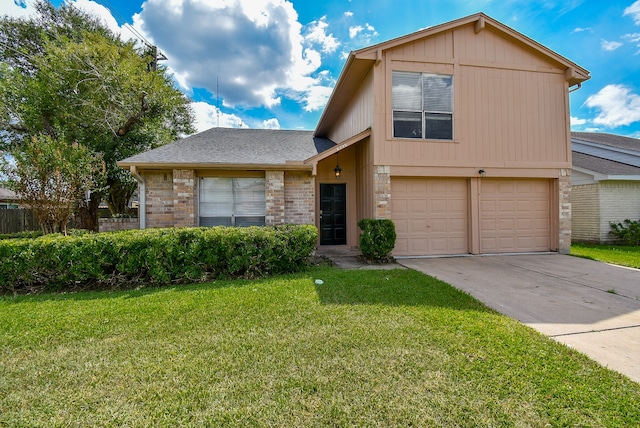 view of front of property featuring a garage and a front lawn