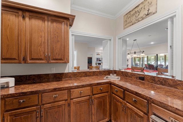 kitchen with ornamental molding and sink