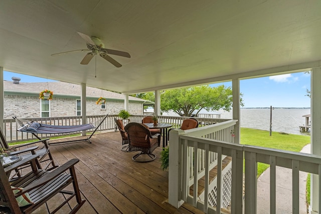 deck featuring a water view and ceiling fan