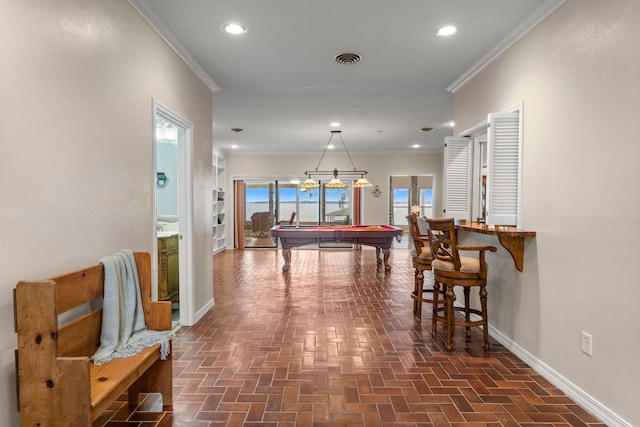 game room featuring pool table and crown molding