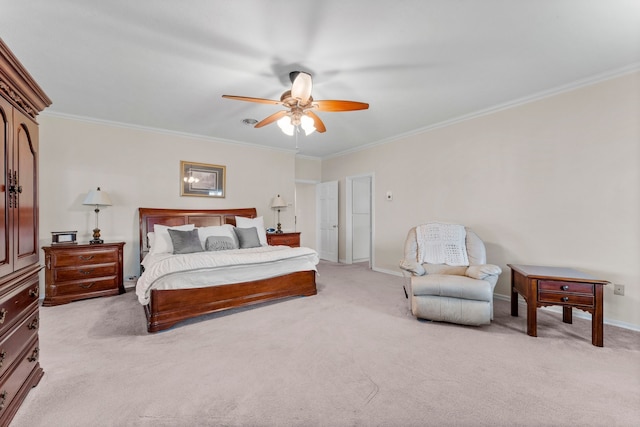 carpeted bedroom featuring ceiling fan and ornamental molding