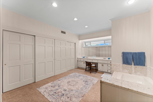 interior space with a closet and ornamental molding