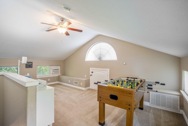 rec room featuring ceiling fan, lofted ceiling, and light carpet