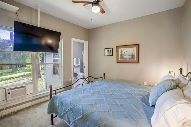 carpeted bedroom featuring ceiling fan, cooling unit, and connected bathroom