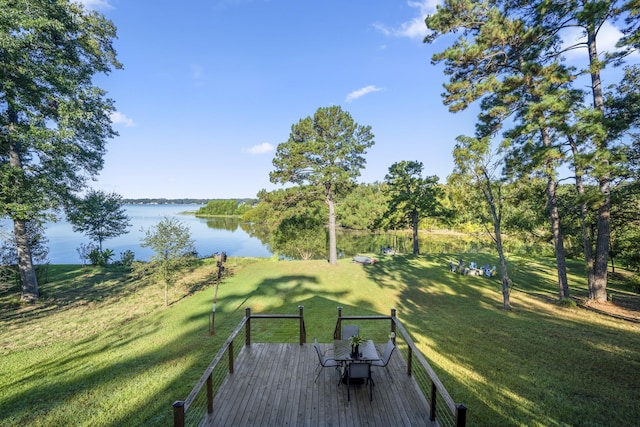 exterior space featuring a deck with water view