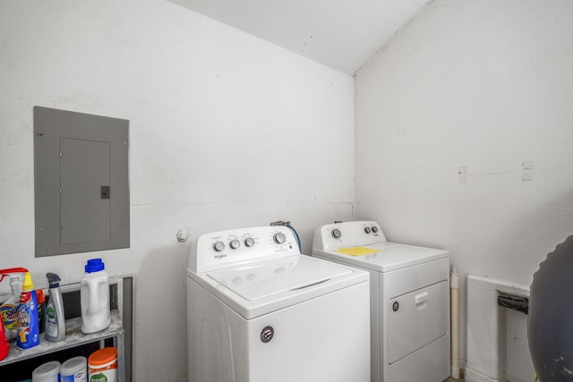 washroom with washing machine and clothes dryer and electric panel