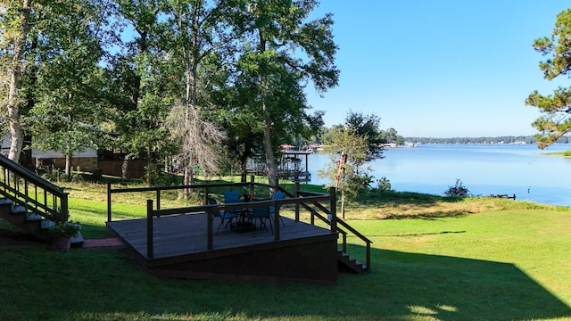 view of yard featuring a deck with water view