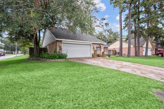 view of front of property featuring a front lawn and a garage