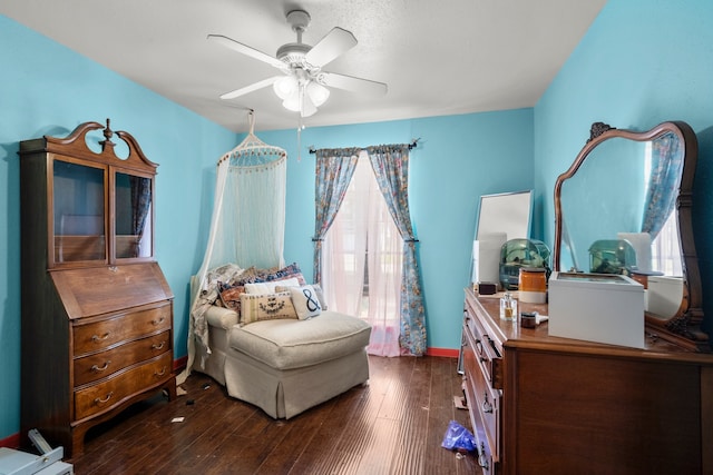 bedroom featuring ceiling fan and dark hardwood / wood-style flooring