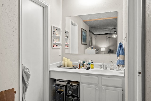 bathroom with ceiling fan and vanity