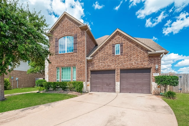 view of front property with a garage and a front yard