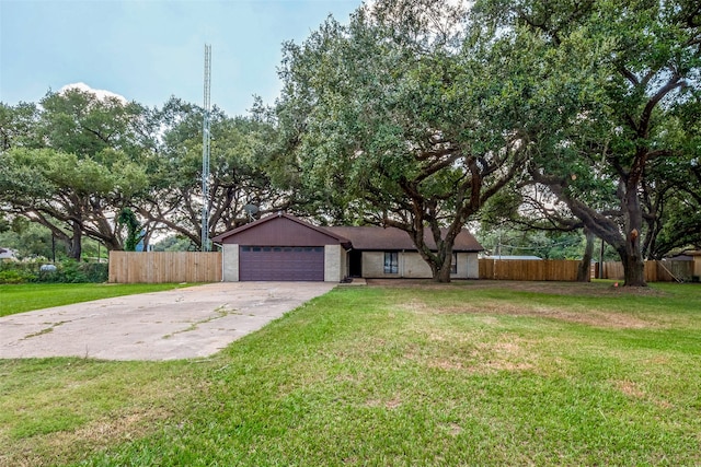 ranch-style home featuring a front lawn and a garage