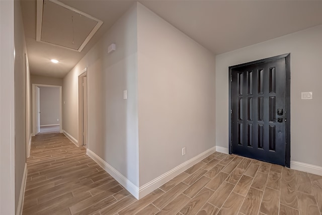 foyer entrance with light hardwood / wood-style flooring