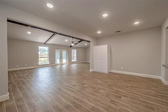 interior space featuring light wood-type flooring, ceiling fan, and french doors