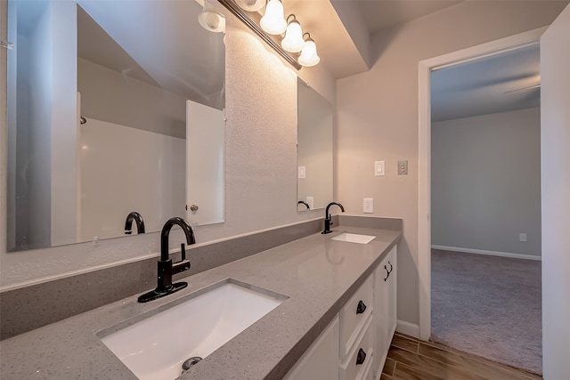 bathroom featuring wood-type flooring and vanity