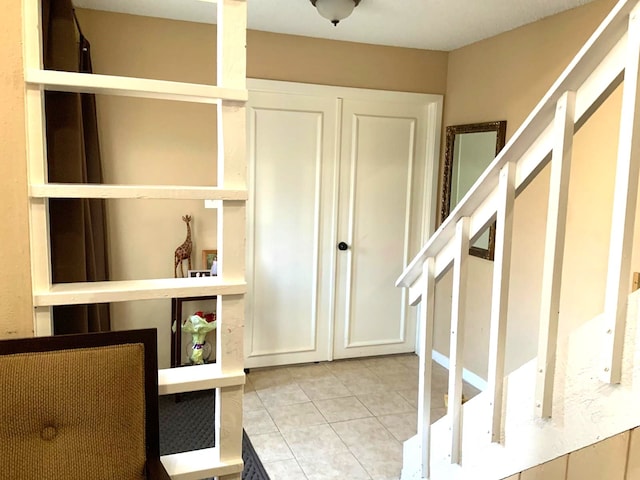 entrance foyer with light tile patterned floors