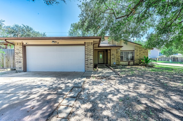 ranch-style house featuring a garage