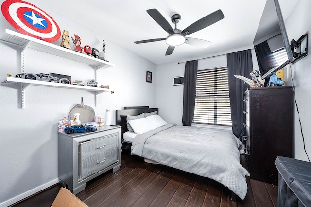 bedroom with ceiling fan and dark hardwood / wood-style flooring