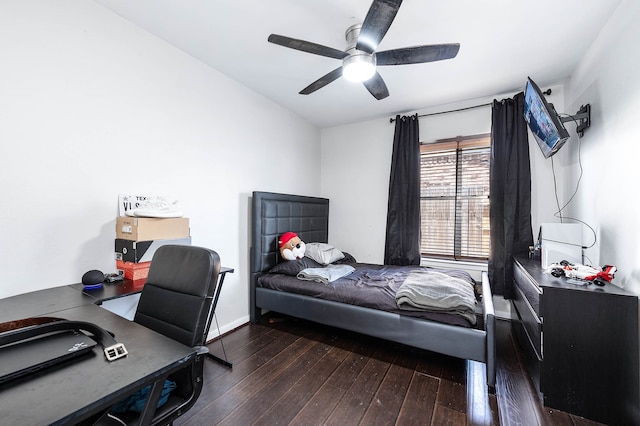 bedroom featuring dark wood-type flooring and ceiling fan