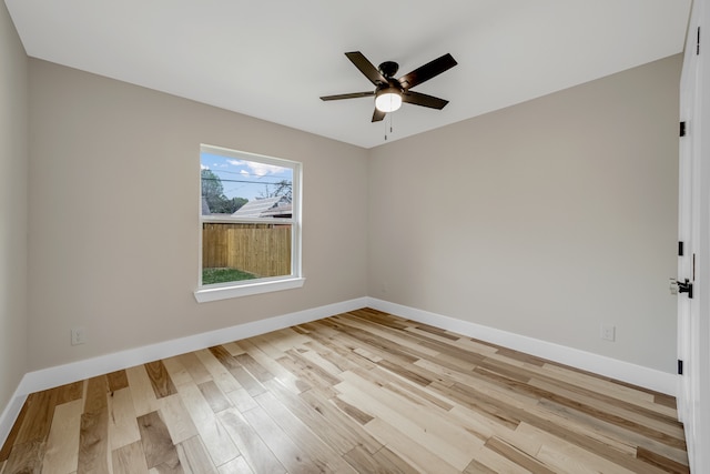 empty room with light wood-type flooring and ceiling fan