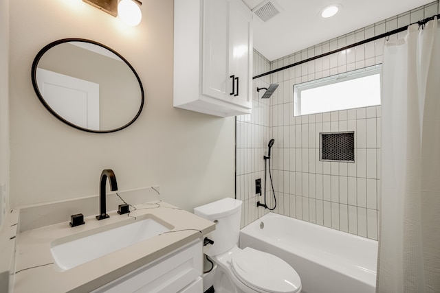 full bathroom featuring shower / tub combo, vanity, and toilet