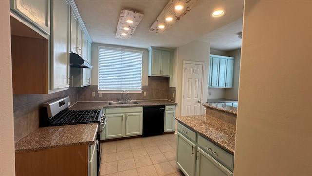 kitchen featuring black dishwasher, green cabinetry, dark stone counters, stainless steel gas stove, and sink