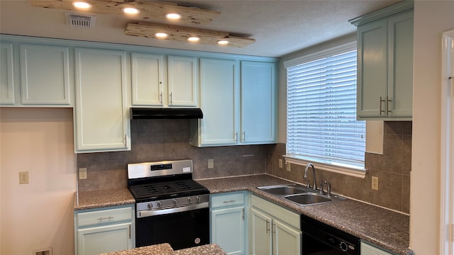 kitchen featuring dishwasher, a textured ceiling, sink, backsplash, and stainless steel range