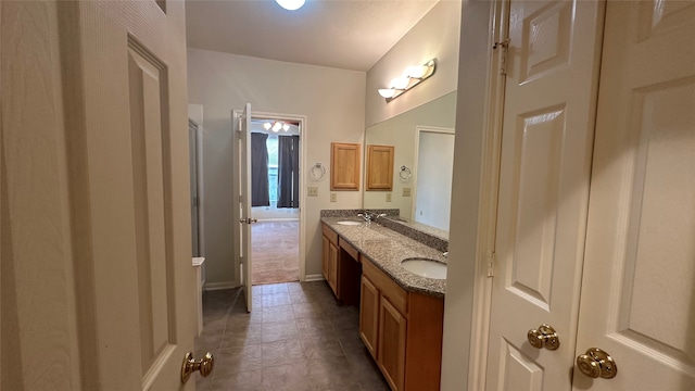 bathroom featuring tile patterned flooring and vanity