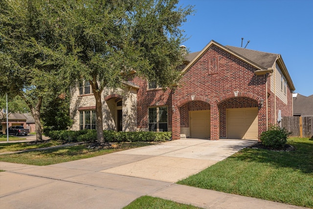 view of front of home featuring a garage and a front yard