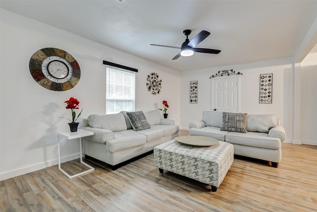 706 Beaumont St, Anahuac, TX 77514 - living area with light wood-style floors, ceiling fan, and baseboards