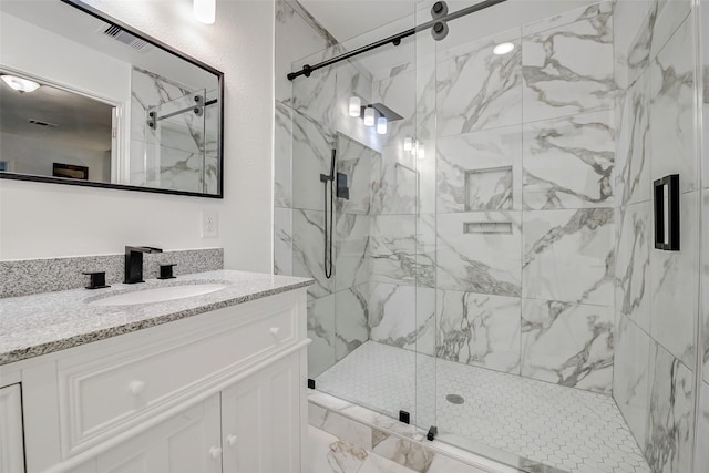 706 Beaumont St, Anahuac, TX 77514 - full bathroom with a marble finish shower and vanity