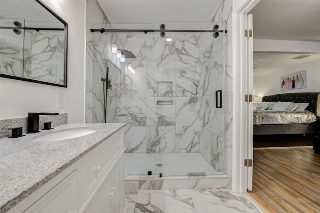 706 Beaumont St, Anahuac, TX 77514 - full bathroom with connected bathroom, a marble finish shower, and vanity