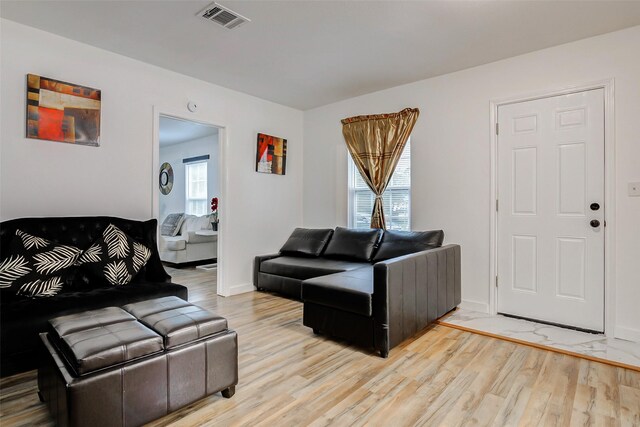706 Beaumont St, Anahuac, TX 77514 - living room featuring light wood-style flooring and baseboards