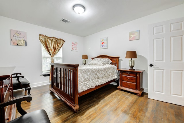 706 Beaumont St, Anahuac, TX 77514 - bedroom featuring hardwood / wood-style flooring and baseboards