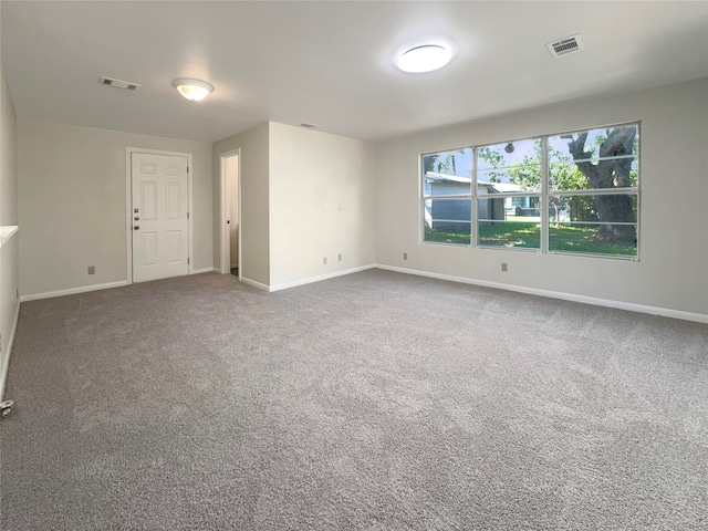 spare room featuring carpet floors