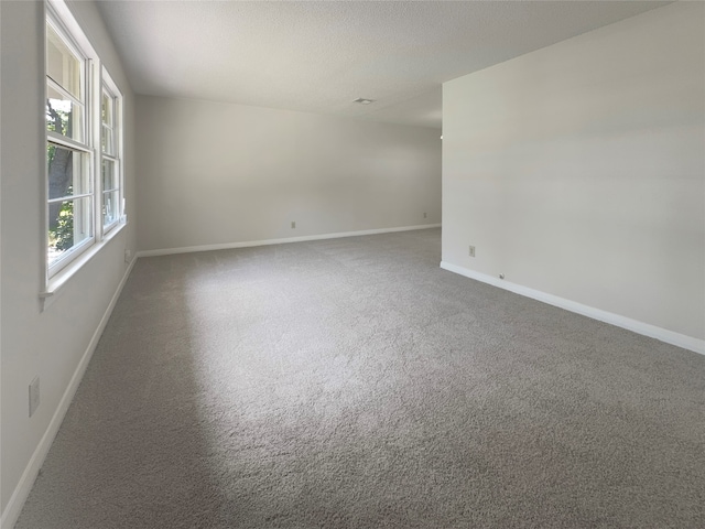 unfurnished room featuring carpet flooring