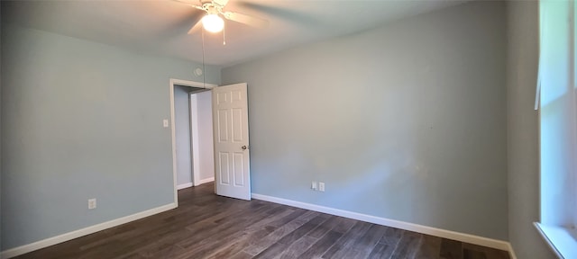 spare room featuring dark hardwood / wood-style flooring and ceiling fan