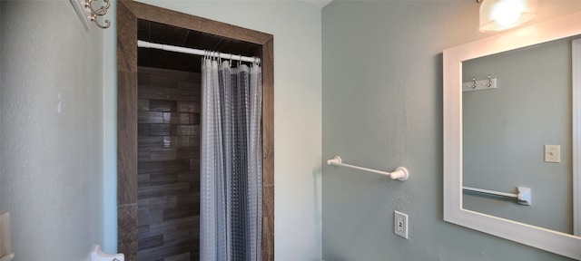 bathroom featuring walk in shower