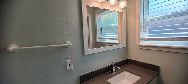 bathroom featuring vanity and a wealth of natural light