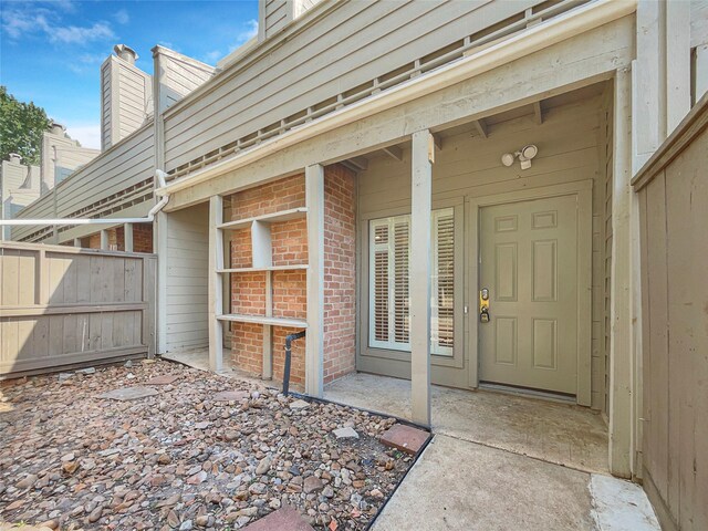 doorway to property with a patio area