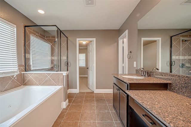 bathroom featuring vanity, separate shower and tub, and tile patterned floors