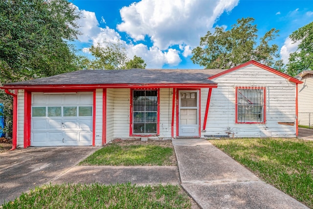 single story home with covered porch and a garage